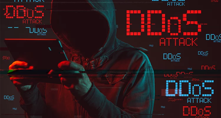 Hacker em foco com letras sobre ataques DDoS no Brasil.